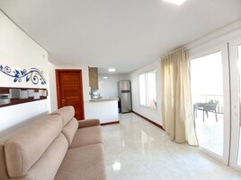 Family Apartment, Balcony, Pool View | Living area | 32-inch flat-screen TV with satellite channels, TV