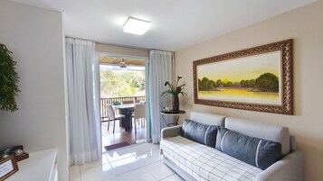 Comfort Apartment | Living area | 32-inch flat-screen TV with satellite channels, TV