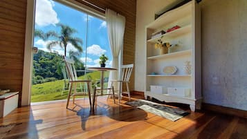 Honeymoon Chalet, Fireplace, Mountain View | Living area | 43-inch LED TV with cable channels, TV