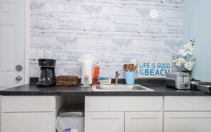 Microwave, dishwasher, coffee/tea maker, cookware/dishes/utensils