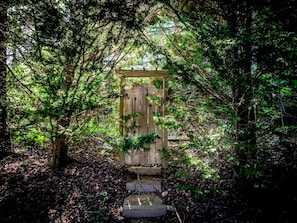 Enter a secluded forest setting through this rustic wooden gate.