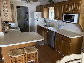 Enjoy cooking in this well-equipped kitchen with a central island and appliances.