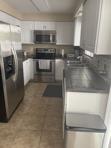 One block to the River, sports park, dogs, AC garage games!