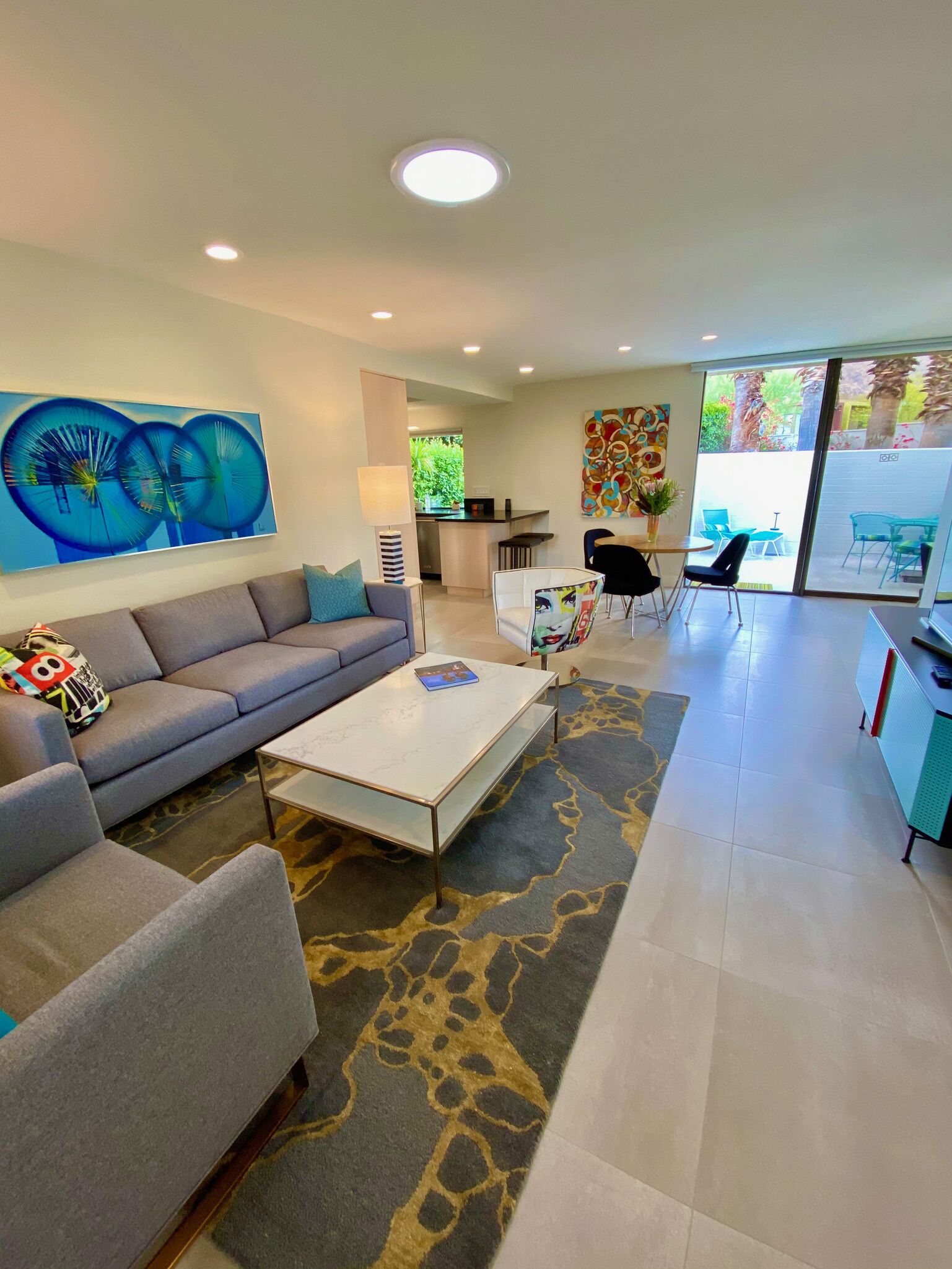 Stylish and sun filled condo with mountain views, private patio and lush grounds