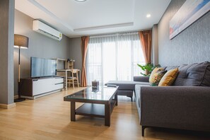 Aiyara Pool View | Living area | 36-inch flat-screen TV with cable channels, TV - The Aiyara (Bang Pa-in)