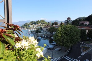 A coastal town with a marina, buildings, and a church.