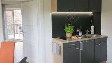 Fridge, microwave, stovetop, coffee/tea maker