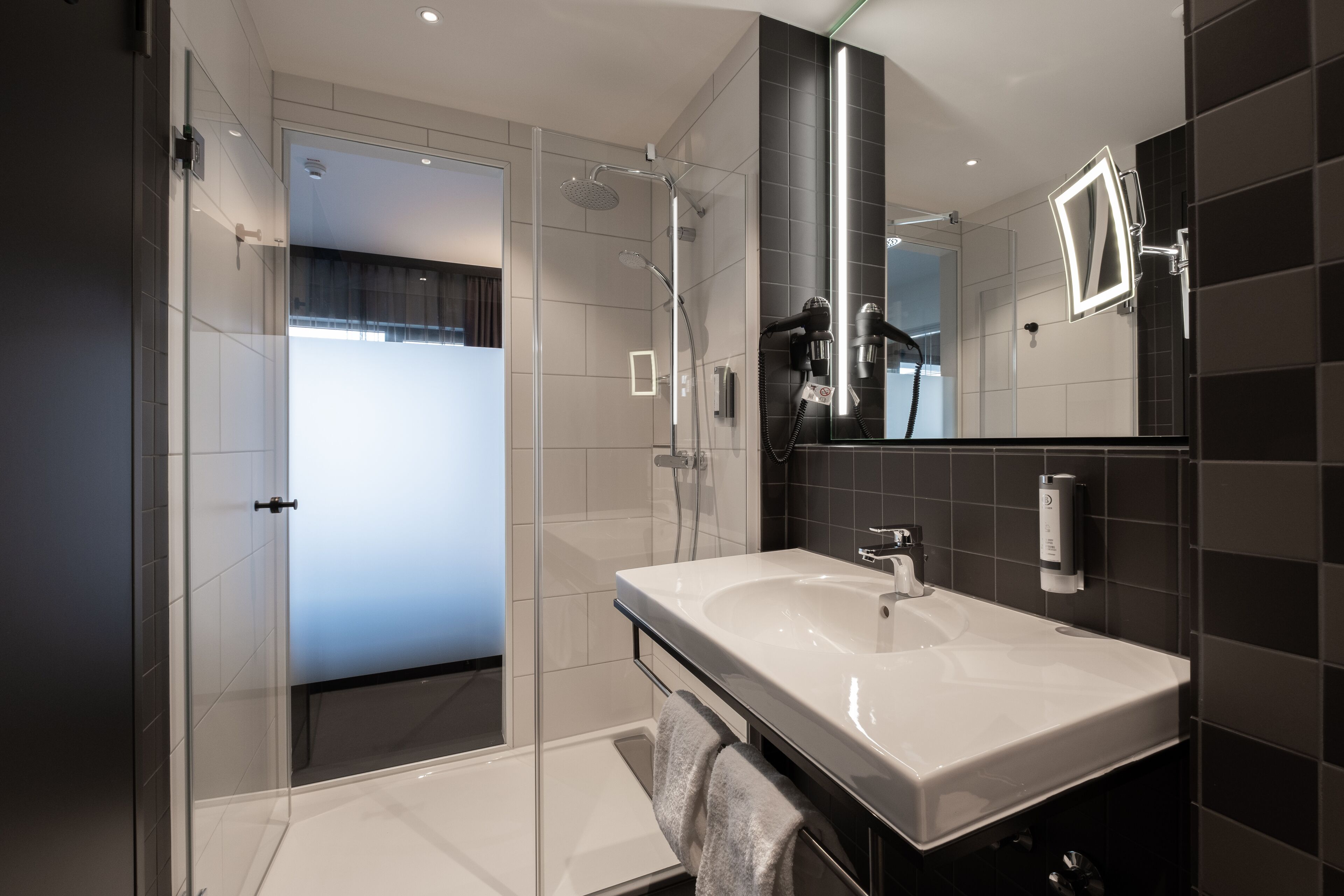 superior double room | bathroom | shower, rainfall showerhead, hair dryer, towels
