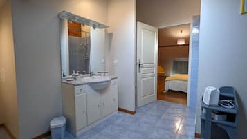 Bathtub, hair dryer, towels, soap