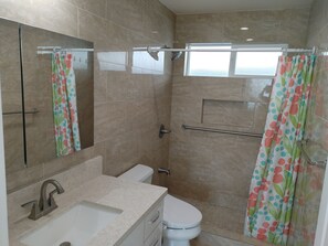 Regadera, secadora de cabello, bidet, toallas 