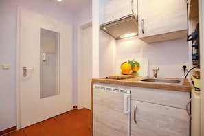 Fridge, microwave, stovetop, coffee/tea maker