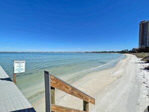 A beach with a sign indicating it's a private pier for residents of Santa Rosa Villas Estates only.