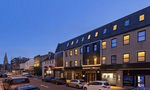 A hotel with a modern facade, large windows, and a prominent entrance. - River Ness Hotel, a member of Radisson Individuals (Inverness)
