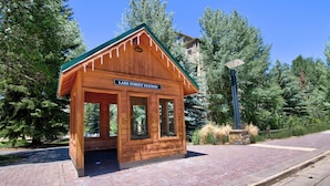 A wooden cabin with a sign reading "LAKE STREET STATION". - Spacious Avon Retreat | Pool, Tennis, 2 Masters & Free Shuttle (Avon)