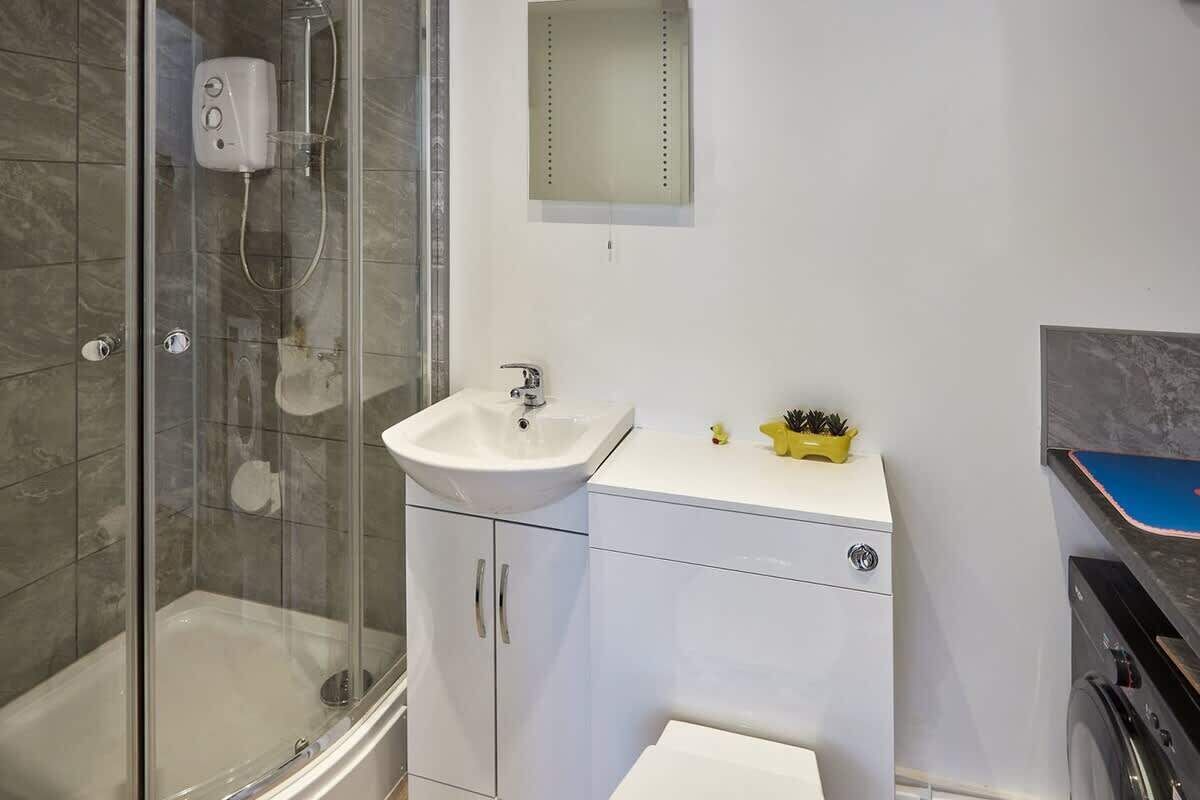 Bathtub, hair dryer, towels, soap