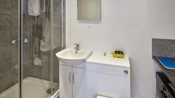 Bathtub, hair dryer, towels, soap