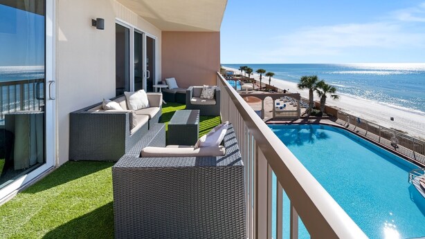 A balcony with a view of the beach and a pool. - Sea-horsey 3 Bedroom Condo by RedAwning (Panama City Beach)