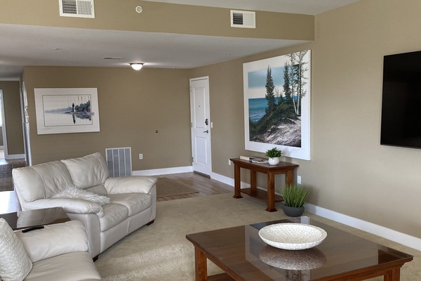 Large Spacious Living Room with Large TV Open Kitchen and Dining Area