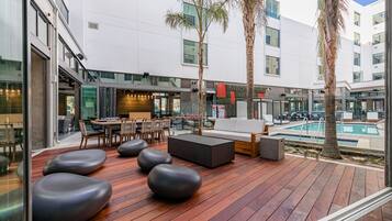 Outdoor pool, open 6:00 AM to 10:00 PM, sun loungers