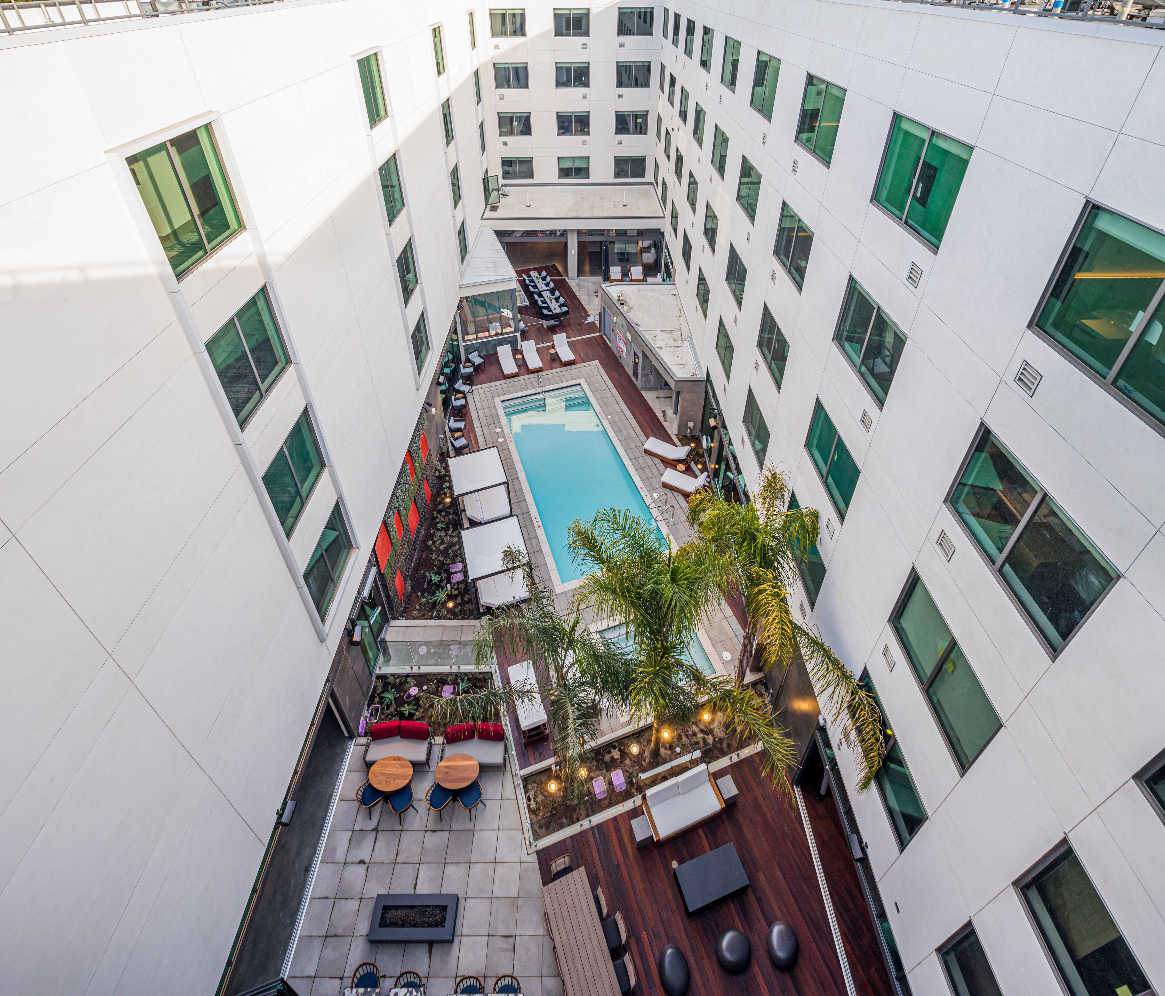 Outdoor pool, open 6:00 AM to 10:00 PM, pool loungers