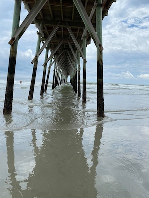 A pier extending into the sea with a clear view of the water and sky. - Beautiful Second Floor 2-Bedroom Two-Bath Condo With Water and Golf Views (Calabash)
