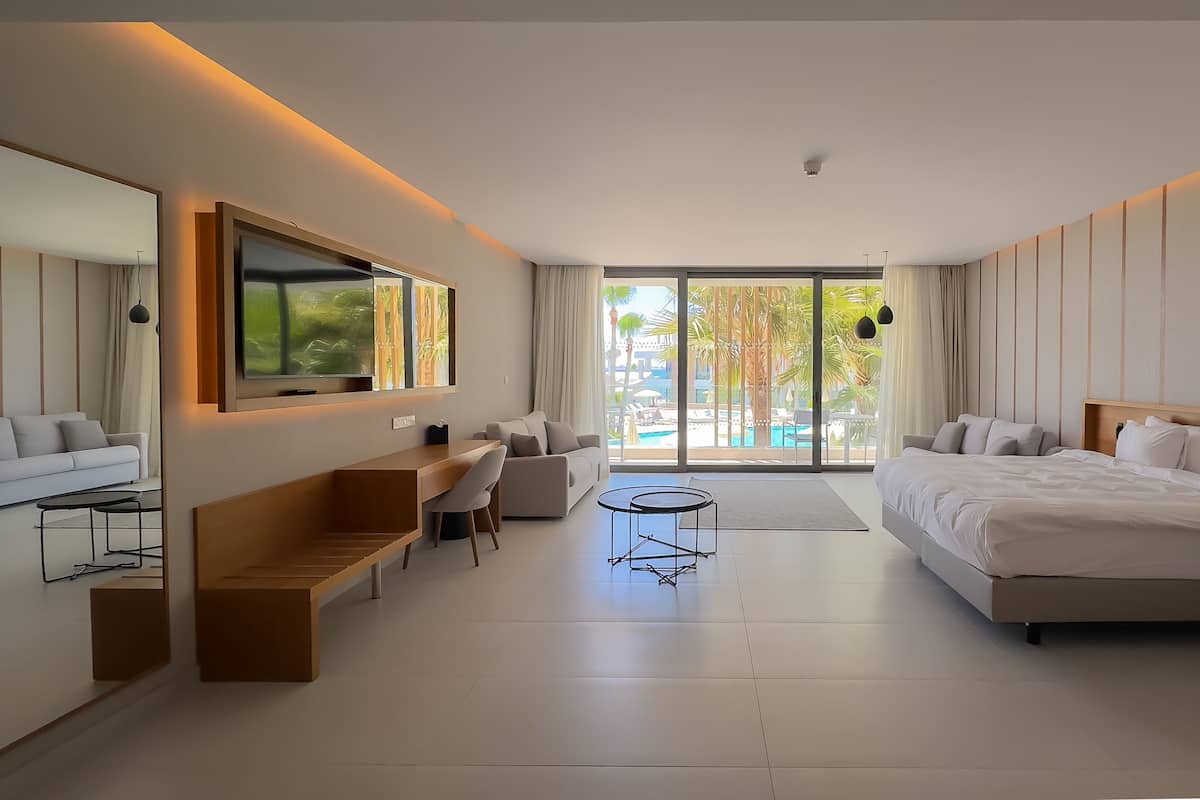 Suite, Balcony, Pool View | 1 bedroom, minibar, in-room safe, desk