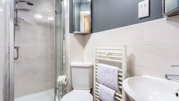 Bathtub, hair dryer, towels