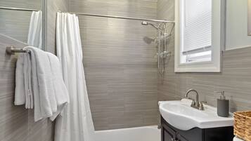 Combined shower/bathtub, hair dryer, towels, soap