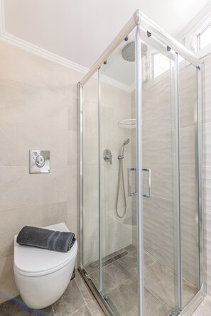 Shower, eco-friendly toiletries, hair dryer, towels