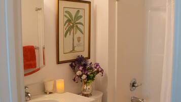 Bathtub, eco-friendly toiletries, hair dryer, towels