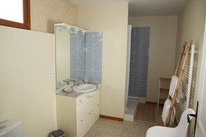 Bathtub, hair dryer, towels, soap