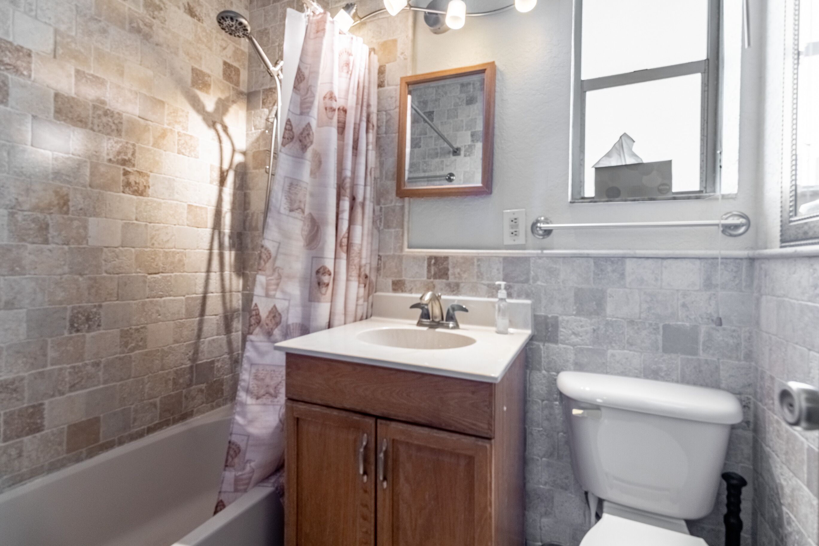 Small but comfortable bathroom with built in storage cabinet 