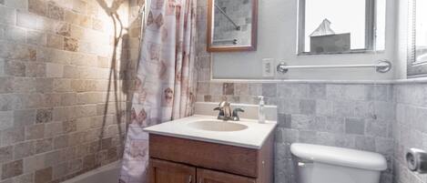 Small but comfortable bathroom with built in storage cabinet