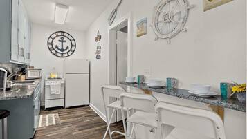 Coffee/tea maker, fridge, microwave, oven