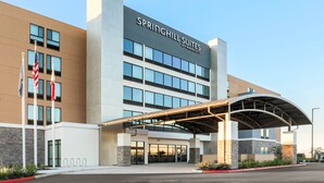 A modern hotel with a clear entrance, large windows, and a covered walkway. - SpringHill Suites by Marriott San Jose Fremont (Fremont)