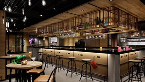 A bar area with stools, a counter, and a variety of bottles and glasses. - Moxy Kyoto (Kyoto)