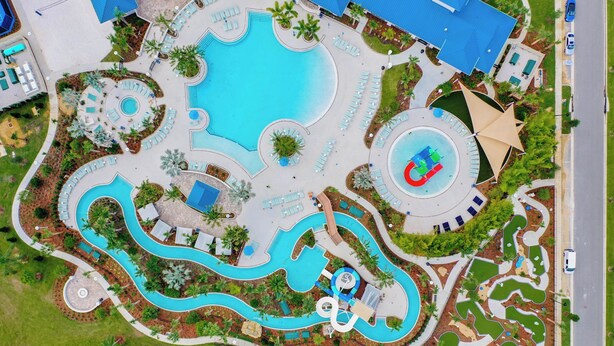 An aerial view of a resort with multiple swimming pools, sun loungers, and a children's play area. - WIR Free Pool Heat/Grill Use, Walk to Lazy River (Four Corners)
