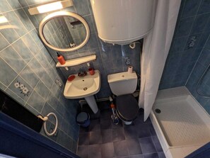 Shower, hair dryer, slippers, towels
