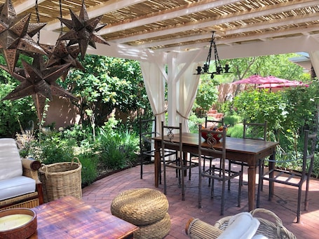 Outdoor dining. BOUTIQUE HOTEL - King deluxe Suite 1/2 mi. from Santa Fe Plaza