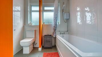 Combined shower/bathtub, hair dryer, towels, soap