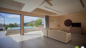 Family Villa, 5 Bedrooms, Partial Sea View | Living area | 50-inch LED TV with digital channels, TV, Netflix