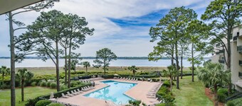 Updated & Gorgeous End Unit with Spectacular Views of Pool & Sound. South Beach Oasis Awaits you!