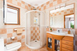 Combined shower/tub, hair dryer, towels, toilet paper