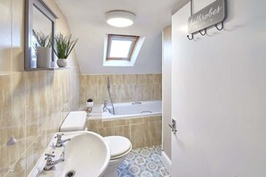 Bathtub, hair dryer, towels, soap