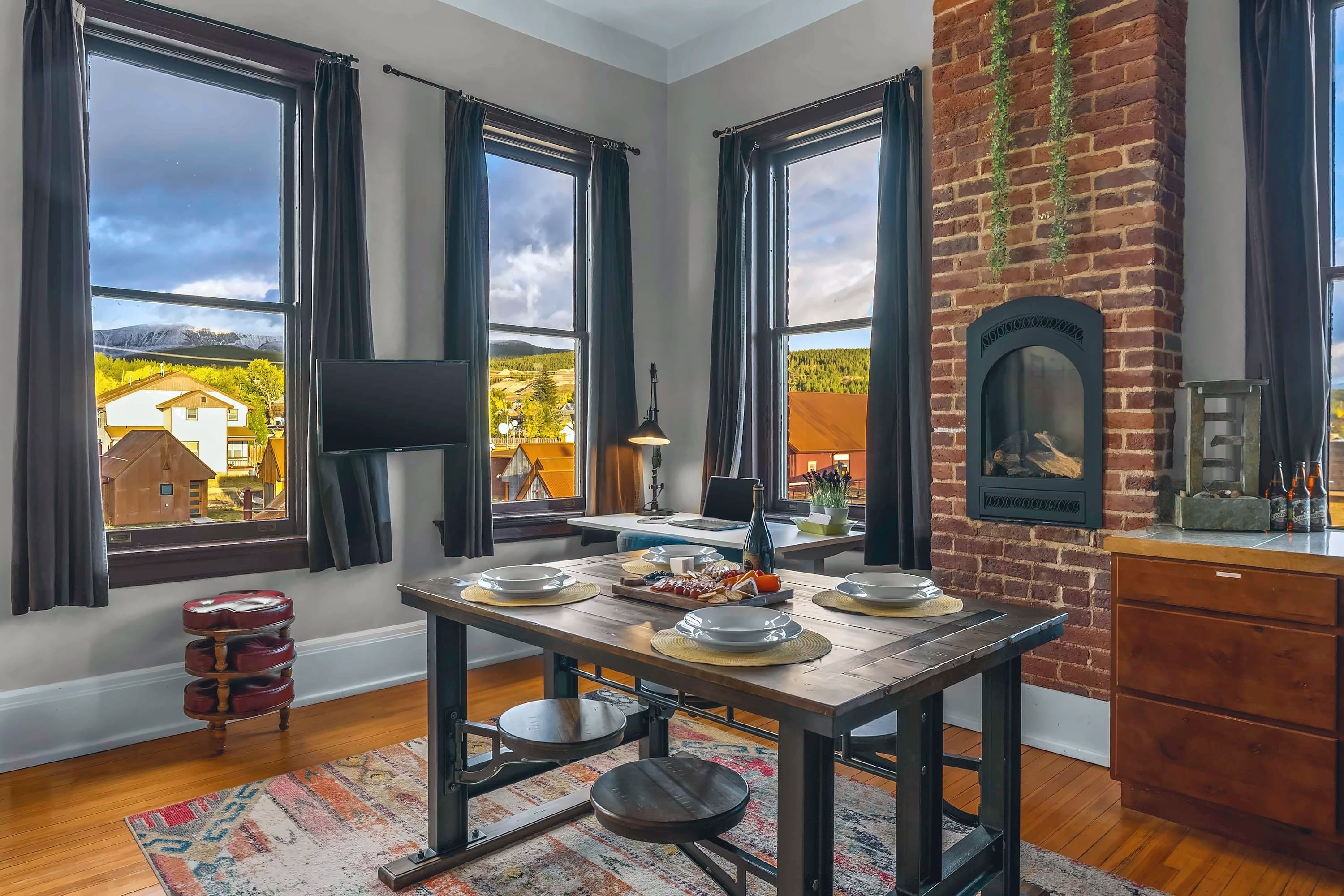 【Living Loft】 14ft cathedral ceilings, original 19th-century brick — your view from the couch