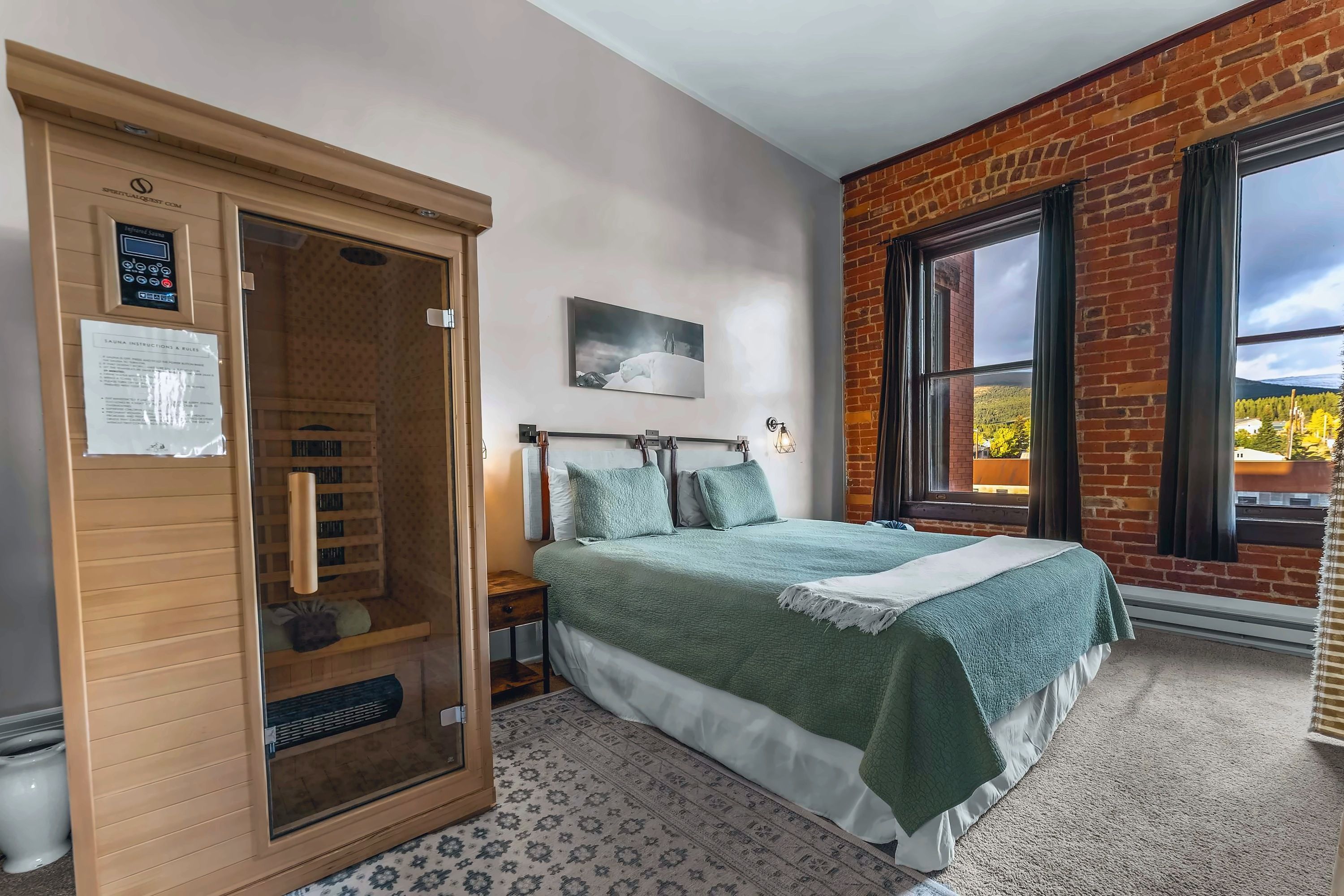 【Bedroom】 King bed under cathedral ceilings — wake up to mountain light from the window across