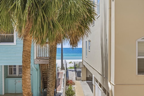 A private beachfront condo just steps from beach  