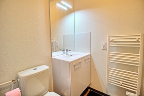 Shower, hair dryer, towels, toilet paper