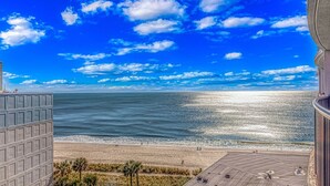 A view of a beach from a high-rise building with a clear sky and ocean. - BEAUTIFUL PRIVATE 9TH FLOOR OCEAN VIEW CONDO; NEWLY RENOVATED OCEANFRONT RESORT (Myrtle Beach)