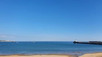 On the beach, sun-loungers